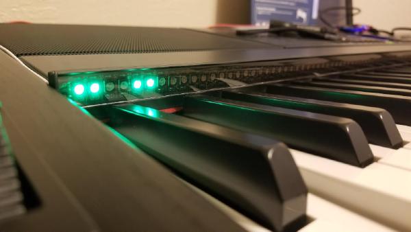 When I decided to learn piano, I found a nice YouTube channel where a guy played with his keys lit up — and it looked pretty cool. So my piano also has MIDI output via USB, and using an ESP32 I connected an addressable RGB LED strip to the notes. I can also connect my phone via Bluetooth and have the LED strip highlight the notes I need to play. That was done, but yeah, I'm still not a great piano player :)